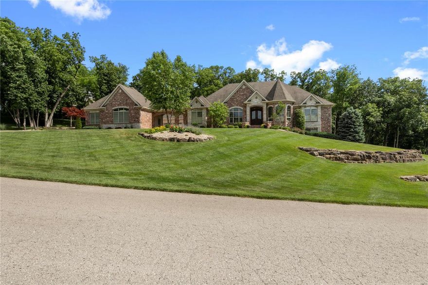 GORGEOUS 3 BR 5 BA Brick & Stone Bax custom home! Perfectly nestled on 3 ACRE wooded lot in gated community of Stonecastle! SO MUCH Detail! 5-Inch Hand Scraped Hardwood Floors! Vaulted Great Room w/Gas See-Thru Fireplace! SALT WATER POOL!24x20 covered patio w/OUTSIDE FIREPLACE!  5-In Hickory Hand Scraped Hardwood Floors! All 3 BEDROOMS ARE SUITES! Vaulted Master BDR w/wall of windows overlooking pool & mature trees. 
Custom Chef-style kitchen... 2 separate Granite Island/Counter work space for family meals, morning coffee & Conversation! Microwave drawer, gas cooktop, DOUBLE Electric ovens, Walk-In Pantry!  UPGRADED Lighting.. WIRELESS SUROUND SOUND....Dual HVAC; 2 TANKLESS WATER HEATERS! SIX Garage STALLS! Sellers have added Approx.2200+ FINISHED LOWER LEVEL.HUGE Media Room, w/Bar, Recreation Room, AMAZING Fitness Center & Finished Powder Room! Framed & READY for a 4th BEDROOM SUITE! Additional FINISHED Work Room could be converted EASILY to 5th BEDROOM if Needed.