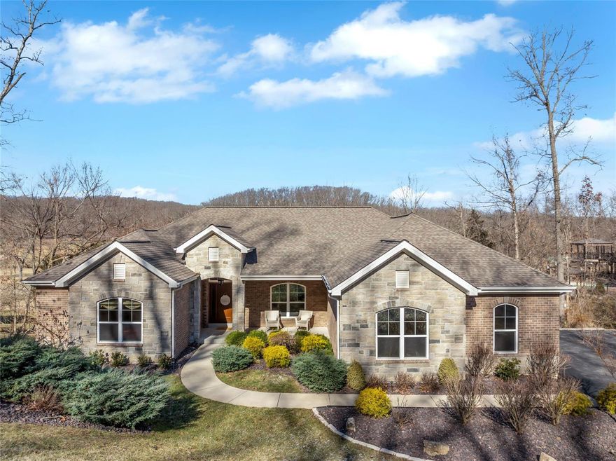 Nestled on 3 private acres in the gated Paradise Valley subdivision in the Rockwood School District, this stunning 4,378 sq. ft. home offers an inviting and open feel with 9’ ceilings and wood floors throughout most of the main floor. The spacious kitchen has custom 42-inch cabinets, granite countertops, and upgraded appliances, all designed for both style and functionality. The Master suite features a huge walk-in closet and a spa-like bath with a tub and separate shower. Large windows fill the home with natural light and provide beautiful views of the golf course, while the finished lower level adds extra space for entertaining. Outside, the in-ground pool is nothing short of fabulous and offers the perfect place to relax or host gatherings.