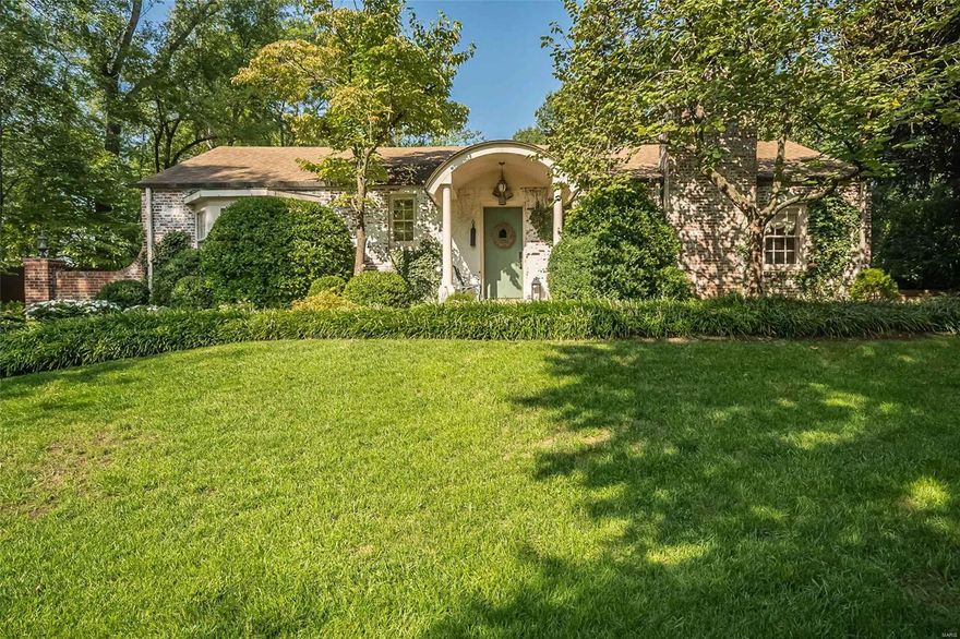 Offering a sense of serenity and sophistication throughout, the 3 bedroom, 2.5 bath "Twin Oak" cottage is truly Ladue's little jewel box. Walking up to the front door, you immediately feel the charm of the original home, once inside you see the cool, calm interiors the current owners have created. The foyer opens to the living room with gas FP, built in bookcases & dining room with doors to the private outdoor covered terrace, reflecting pool and waterfall. The open kitchen features custom cabinets, GE double ovens, Bosch dishwasher, Viking 6 burner cook-top and 48"SubZero. The primary suite has an updated bath, two closets and bay window. Two other bedrooms share an updated bath . The family room adjoins the hearth room with vaulted ceiling, 4 skylights, beautiful wall of windows and a sliding glass door to the outside terrace. The outdoor spaces  are the entertaining oasis of the home.  2 car oversized garage, new roof & skylights 2024, greenhouse/shed, flagstone walkways and more.