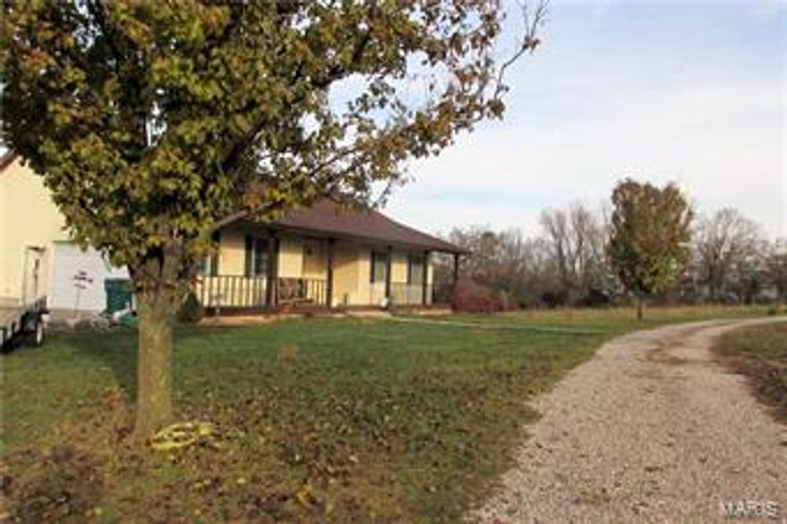 Here is your opportunity to own this 4 bedroom ranch sitting on 6.7 acres (+/-) right off HWY 32. This home is plenty big for any family with 3 main floor bedrooms, one being a master suite with separate tub and shower. Open living/dining/kitchen living walks out the two level back deck over looking gentle sloping back yard and woods. Makes for a beautiful sunset. 
Downstairs is the 4th bedroom, beginning of the 3rd bathroom. and HUGE family room with full service wet bar.  Basement walks out the the yard and portion of the deck that is just waiting for a pool to be installed. As if the home and acreage are not enough- property offers partially fenced pastures with a large  pole barn already in place.  Attached garage with side entry off the circle drive makes for convenient access to the main floor mud room. Additional Rooms: Mud Room