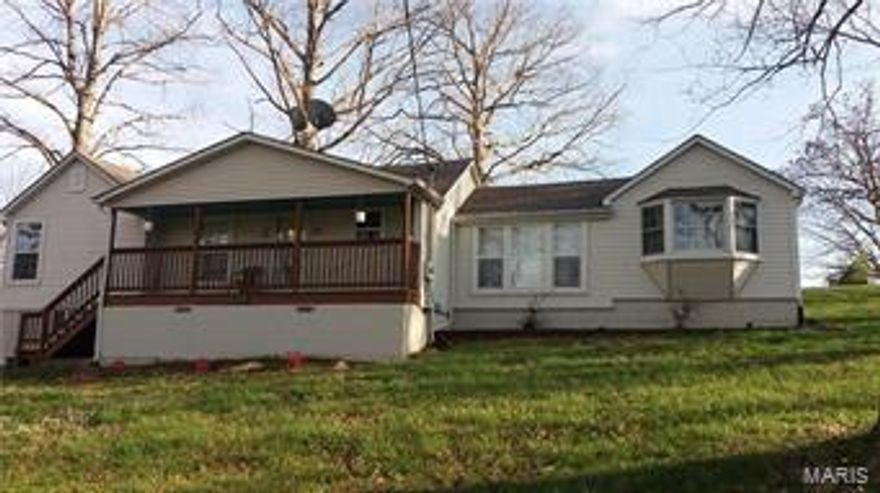 Welcome to 2400 Gravois Road! This charming 2 bedroom, 1 bath ranch is truly adorable! Sits on a little over 3 acres of wooded land in the back and beautiful shade trees in the front! You will find the open kitchen, living and dining areas make this home the perfect open feeling you are looking for!! Updates include new roof in 2015, newer vinyl siding, updated kitchen with new tile backsplash and freshly stained kitchen cabinets!