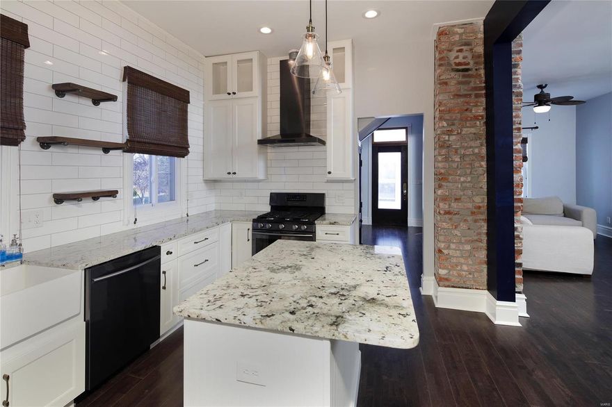 A totally renovated 3 bed/2 bath home is perfectly situated and is move-in ready on a large and level lot in a friendly neighborhood. The front porch is a perfect size for greeting your guests and storing your shoes and boots. The original front door with beveled glass opens to an oversized foyer with a view of the living room and of the wood paneled stairway to the second floor.  Some of the original interior doors are still utilized in the home. A beautifully redesigned kitchen w/subway tile, display shelving, white cabinets, granite countertops, gas range, black stainless steel diswasher and French Door refridgerator will meet your everyday cooking and entertaining needs. There is a bedroom off the kitchen and a bathroom with shower that is accessible from the kitchen and living room. Newer windows throughout, roof, siding, electric panel, hot water heater and hvac have all been updated for your comfort.  A home warranty plan is being offered to the lucky buyer.