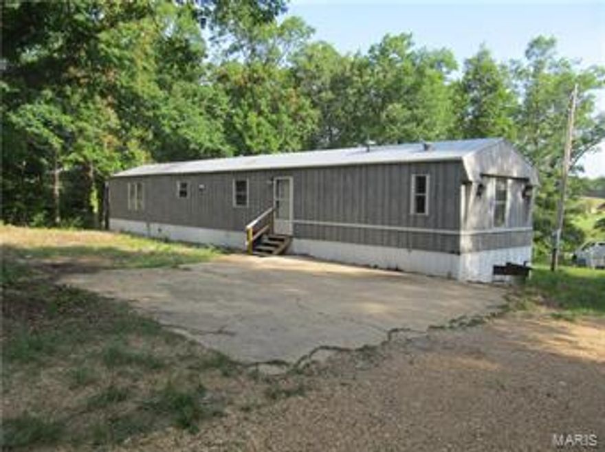 This home has had recent updates to cooling, system flooring and paint.  Beautiful view from 1 Ac. lot.  3 Bedrooms 2 baths, utility and spacious living/kitchen area.  There is a concrete pad for parking.  Close to South Gate of FLW, Owner may consider financing.