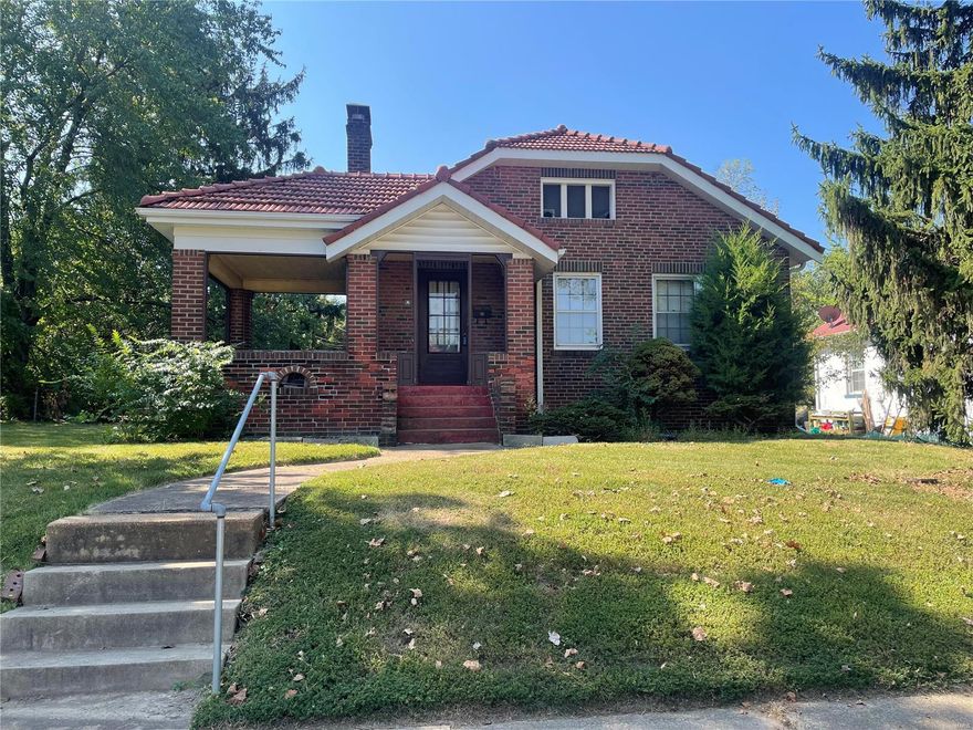 Seller is looking for highest and best. All offers will be presented Monday at noon. Welcome Investors! Seller is selling this home " AS IS." Seller to pay for NO inspections or repairs! Also, homes of this size and quality are selling between $160,000-$220,000! Outside one will find some maintenance free features, including newer gutters and wrapped soffits and fascia, plus full brick construction with a clay terra cotta roof. Furthermore, there is a nice 2 car garage and large front porch.Inside one will find all hardwood floors including the kitchen, a fireplace in the LR, below the leaded glass windows. The solarium room adjoining the living room may be the third bedroom. This home is a great investment for the ambitious!