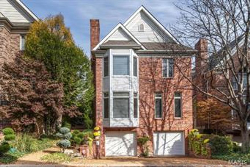 This fantastic contemporary home was featured in St. Louis Homes & Lifestyles. A stylish 2-story entry, attention to detail, &  classic architectural elements attest to the owners demanding standards. The step down living room has high ceilings, a bay window, wood floors, cove lighting & a gas fireplace. The heart of this home is the kitchen, complete with designer appliances, a breakfast bar, abundant cabinetry, built-in desk & wet bar/butler’s pantry. There is a bay windowed breakfast room & a hearth room that opens to the spacious deck. Upstairs there are 3 en-suite bedrooms. 8' French doors lead to the master, which has a tray ceiling & a bay window. In the master bath, the double sinks, jet tub, steam shower, skylight & a vaulted ceiling make bath time a joy. Additional features include an elevator, three-car garage, 2nd floor laundry, and lots of recessed lighting. Enjoy a maintenance-free, zero lot line home on a private street within walking distance to downtown Clayton!