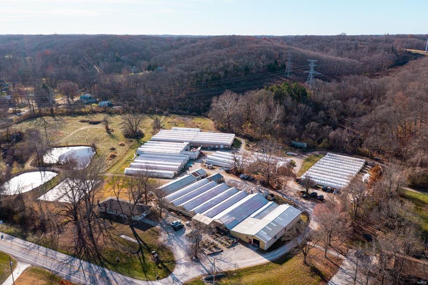 Fully operational/profitable greenhouse in Wildwood, MO! For 40+ yrs, Fahr Greenhouse has served clients w/ successful retail/whlsale operation. 5± ac, zoned commercial. Multiple impvmts - metal barn, ofc space, 3 bd 2 ba rental home, & 52,944± sf of greenhouses. Automated heating/cooling, irrigation & 1.3m btu biofuel boiler to heat 31,896 sf. of greenhouses at 25% nat gas cost. Business of Fahr Greenhouse is part of sale. Includes all tools, tractor, forklift, vehicles, plastic roofing, greenhouse equipment, computers, Intellectual properties, & crop growing supplies. Licenses to grow ind hemp & contract as rooting station for hemp breeder. Addtl 6.5± acres avail. Long term Liabilities responsibility of Seller. All A/P (crop related/retail inventory) & current utilities responsibility of the Buyer. All live crop inventory belong to Buyer. All A/R belong to Buyer. Value of inventory (live plants) at time of sale open to negotiation. Financial info avail for review if offer is made. Location: High Traffic, Hwy/Interstate Frntg, Suburban