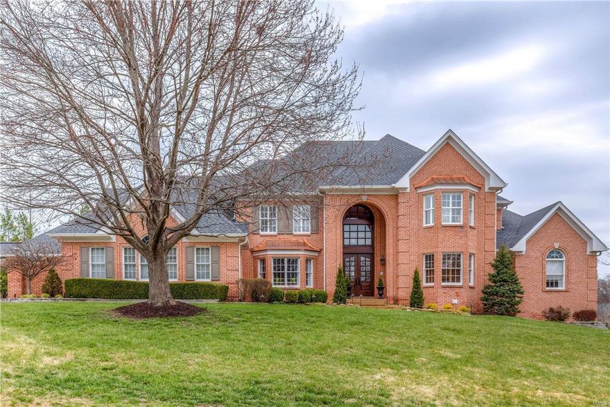 Magnificent 1.5-sty Estate home on 1-ac grounds! 2-Sty hardwood foyer leads to library-paneled study with custom built-ins, elegant dining room & spectacular great room with dramatic Palladian windows, brick fireplace & wet bar. Exceptionally large kitchen with granite countertops, professional quality appliances & 10’ center island adjoins light-filled breakfast room with bow window & vaulted hearth room with floor-to-ceiling stone fireplace flanked by built-in bookcases. Sumptuous master bedroom suite features 2 walk-in closets, marble fireplace & beautifully appointed bath w/ Jacuzzi & steam shower. T-staircase accesses 3 additional bedrooms, 1 with ensuite bath & 2 with Jack n’ Jill bath, & bonus room with work center. Incredible walk-out Lower Level includes recreation room with stacked stone fireplace, game room, media room, 2nd kitchen & wine room plus office, workout room, 5th bedroom & 1 ½ baths. Impeccably landscaped lot with deck, 3 patios, pool, hot tub & two 3-car garages.