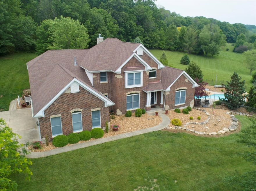 Beautiful 1.5story custom all brick home located in desirable Augusta Shores. Welcome into the 2story entry flanked by the formal dining room & well appointed study. Great room features expansive wall of windows looking out to private 2.65 acre lot. Stacked stone dual sided fireplace connects to amazing K-Build designed kitchen! You will be blown away by the attention to detail offering top of the line Jen-Air wifi enabled appliances including 66in refrigerator, mitered edge quartz countertops, soap stone titled floors & hand painted tile backsplash. Main level master suite, wonderfully designed w/dual vanities, freestanding tub & spacious glass surround shower. Upper level offers a nice loft area, 3 generously sized bedrooms w/spacious closets plus 2 additional full baths. Head to finished lower level, hang out around the designer bar, sprawl out in front of the tv on movie night, or enjoy the game room! Walk-out to the salt water in-ground pool or enjoy an evening around the firepit. Additional Rooms: Mud Room