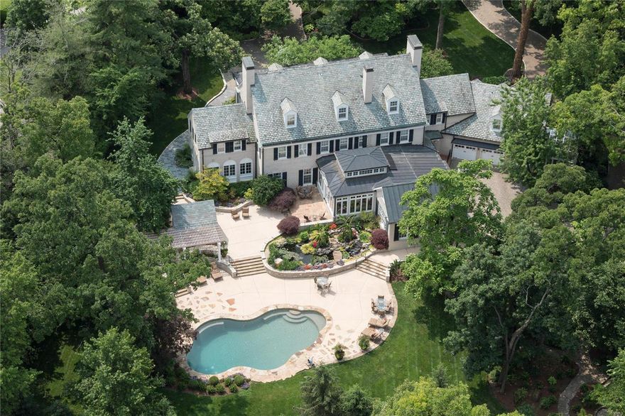 Resplendent showcase property. A phenomenal value. This vintage estate is fully renovated, throughout. Current owners have $4,500,000 total investment in the home, transforming a classic Brentmoor Park manse into a fully modern masterpiece. #29 encompasses six zones of geothermal heating and cooling, state of the art Savant system to easily make SmartHouse capable. The modern kitchen, hearth and family addition was completed in 2008. The second level primary bath was gutted and rebuilt new in 2017. Landscape is extravagant, with a paver walkway, tropical and exotic plantings, a salt water pool, waterfalls, koi pond, and greenhouse. The home provides highest levels of privacy, elegance and luxury. The primary bedroom is spacious, with private dual closets. All bedrooms, en-suite. A paver circle drive leads to garage parking for three, in a heated/cooled environment. A custom 5000 bottle wine cellar is designed to replicate a cave. Attached guest apartment, completes the property. Additional Rooms: Sun Room, Wine Cellar