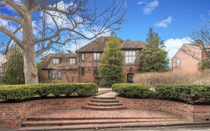 Impressive 2 story brick tudor in desirable Lake Forest.
Inviting entry with elegant open staircase, stunning lead glass windows and terrazzo floors make for a dramatic first impression. Come be captivated as you enter the large living room with beamed ceiling, wide plank wood floors and oversized fireplace. 
Living room leads to lovely family room bathed in natural light & featuring vaulted ceiling, see thru fireplace and access to patio/pool area. Formal dining room with fireplace and updated eat-in kitchen. Wonderful flow for entertaining!
2nd floor can be accessed from front & back stairs. Master suite boasts updated bath w/natural tumbled stone & walk in closet. 3 additional bedrooms & 2 baths complete 2nd floor. Lower level recreation rooms.
Professionally landscaped, and rear yard with in ground pool offers serene privacy and is ideal for outdoor entertaining. 
3 car heated garage.  Add Clayton schools, easy access to hwys, shops & restaurants & you have a fabulous find!