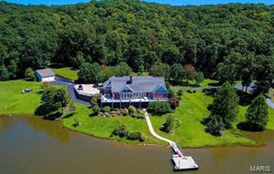 Exquisite ranch home on 242.73 acres with 10 stall horse barn, outbuildings and 24 acre lake. This home has an up to date eat-in kitchen, living room with wood vaulted ceiling, large foyer, wood flooring throughout and separate dining room with wood trim. The home has ample space with 5,000 sq. ft. of finished living area. The lower level offers huge recreation area, card room, wood bar, kitchenette, family room & double-sided stone fireplace. There is a full-length deck to accommodate large gatherings with a breath-taking view of the lake. The master bedroom suite has a coffered ceiling with fan, large closet and French doors leading to the deck. The nice master bath has dual wood vanities and a separate tub & shower. The unique horse barn has 10 separate 12 x 12 stalls, wash room, tack room, 2 foaling stalls, large office, kitchen and lounge. This property offers many extras, numerous outbuildings, lots of privacy and plenty of acreage in a great location close to Hwy U & Warrenton.