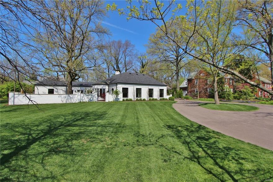 Remarkable renovation of 1939 Regency house for today's living! New stately brick drive court leads to east side front entry. Barrel vaulted living room with semi-circular window opens to new 2000 sf brick walled courtyard with stone lion head fountain, wrought iron gates, bluestone patio and custom designed plantings. Main floor master bedroom suite features stain glass window, new ensuite master bath with heated marble floors and custom closet. Bedroom with built-in shelves and ensuite bath provides guest room or home office option. New center island kitchen with stainless GE Monogram appliances and Quartz countertops. Seamless new addition wraps courtyard and repeats architectural detailing of original house. Interior includes light filled open family room, gas fireplace/built-ins, additional bedrooms, main floor laundry. Large finished game/media room and bedroom/office on LL. ALL NEW Marvin windows, systems, roof, gutters/down spouts, custom landscaping, and asphalt driveway!!!