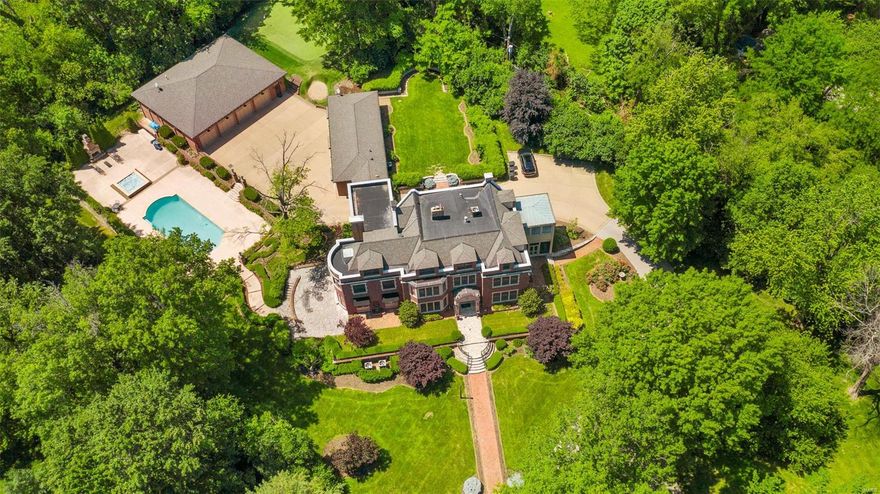 2.7 acre architecturally significant Ladue estate and grounds exquisitely updated/built by Higginbotham in ’06-‘07 with cosmetic updates in 2020. 3 story 8,000ft main home built in 1910 for Cella family. Enlarged pro-series kitchen: Wolf cooking, Sub-Zero cooling, large island, eat-in area & open to a terrace! 10+ ft ceilings on 1st & 2nd floors, grand entry, library, formal study/dining, & tremendous wine cellar + tasting room below. 2nd fl: Large laundry, 3 beds, 2 full baths. Master suite & sitting room with custom built-ins, updated marble bath w/ dual vanities, separate tub/shower, & impressive closet. 3rd floor perfect for guests, au-pair, or kids. Porte-cochére connects 1,400 sqft sports lounge w/ full bath, steam shower & fully equipped kitchen. HVAC’d 8 car piggy-backed garage with speakers & TVs. Incredible outdoor setting w/ Pebble Tec pool/spa, outdoor fireplace & golf green/short-range as well as tremendous terraces, quiet courtyards. Private & peaceful setting. Additional Rooms: Wine Cellar
