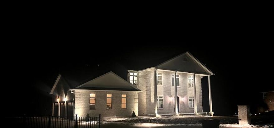 Exquisite all-brick estate with stunning views in Hannibal, MO! Step into luxury with the breathtaking two-story all-brick home, boasting 5,838 sq. ft. of meticulously designed living space across three fully finished levels. With 6 bedrooms & 7.5 bathrooms, this property offers the perfect blend of comfort & elegance. The open floor plan creates a seamless flow, ideal for entertaining. A custom-designed kitchen serves as the heart of the home, offering premium finishes & ample space. Enjoy beautiful views from every room or take in the scenery from the expansive deck. The lower level is an entertainment haven, featuring a media room, family room, & dedicated exercise room to meet all your lifestyle needs. Two primary bedroom suites provide ultimate convenience & luxury, making this home perfect for multigenerational living or hosting guests in style. This rare gem offers unparalleled space, luxury, & functionality in the heart of Hannibal. Don't miss the opportunity to make it yours!