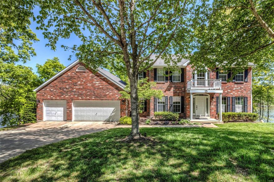 The PRICE & the VIEW have been improved on this WATERFRONT in a sought after no-wake cove. A  great home for entertaining! Enjoy over 200’ of waterfront featuring: dock w/ boatlift & room for a pontoon, separate swim dock, outdoor seating & dining areas. Two maintenance-free decks: open air & covered as well as a paver stone patio area. Inside: separate dining, office w/French doors, and open concept, eat-in kitchen that connects to the living room. Upstairs, you’ll be impressed w/ large bedrooms- two share a Jack-n-Jill bath; another w/ en suite bath. The primary suite w/ custom, walk-in closet and bath w/ dual vanities, separate tub & shower. The LL family room & built-in bar is perfect for entertaining. Flex space that can serve as a second office, craft room, workout studio-you decide. There’s even a sleeping room w/ a built-in Murphy bed & adjacent full bath to service the floor. 2020- pro painted interior; 2022- all carpet & LL flooring replaced. Close to Hwy 70/61/40 & Page ext.