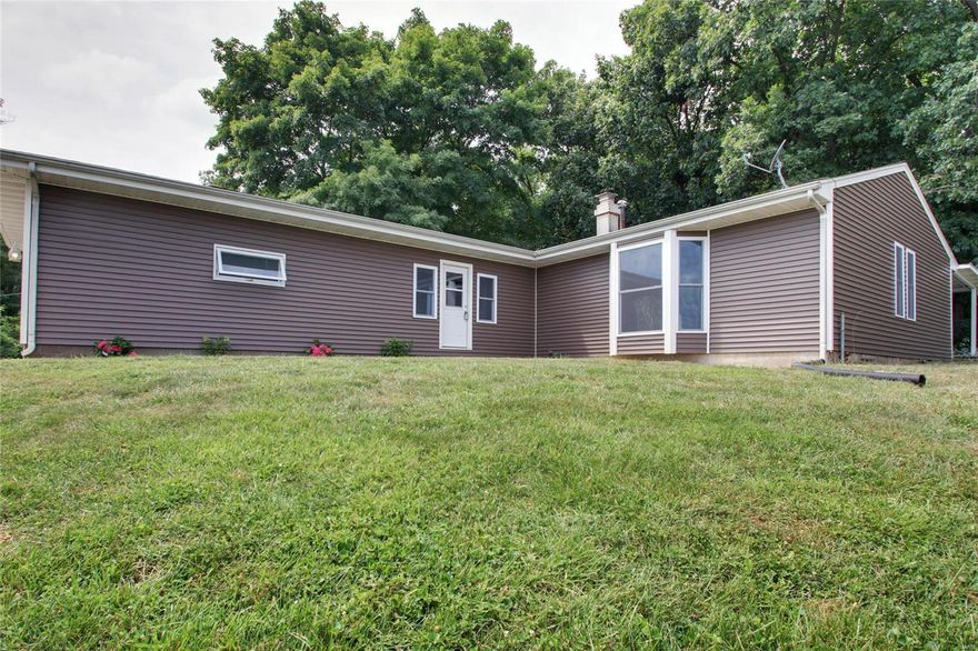 You'll fall in love with your view from this stunningly renovated 4 (could be 5) bedroom ranch home on 1.5 acres perched atop the hill in Canton. This home offers so much to its new owners including an open floor plan main floor with a massive sunken living room complete with a fireplace, large eat in kitchen, and two huge bedrooms with loads of storage. The full, finished, walk up basement doesn't disappoint with 2 more bedrooms (both with egress), a large family/rec room, another full bath, and an office. This home has a spacious covered patio perfect for outdoor entertaining and an oversized attached garage. There is nothing left to do on this one but move in!