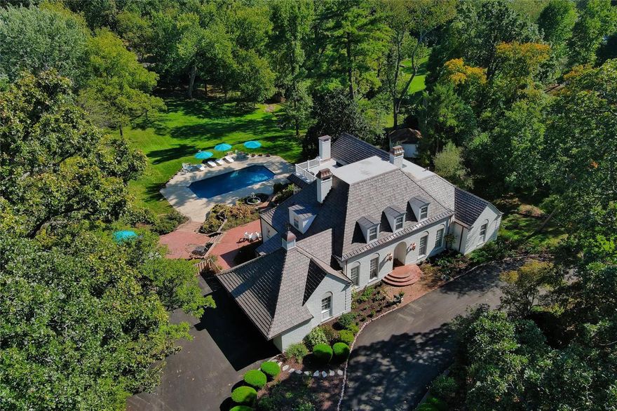 Fabulous 1.72 acre estate in the heart of Ladue. 4 Bed, 6 Bath home on sought after Apple Tree Lane. Gorgeous grounds w mature trees, pool area & extensive patio & gardens. Newly painted exterior, NEW roof, & new copper gutters, downspouts & flashing. Timeless elegance is found throughout this special property with custom period millwork, built-in bookcases, wood flooring and generous ceiling heights.  Formal entry opens to gracious Living Room & formal Dining Room.  Eat-in Kitchen w center island & natural stone countertops. Beautiful Family Room w coffered ceiling, fireplace & wet-bar. Original main floor en suite Master Bedroom features large picture window overlooking rear landscape. 2 add bedrooms & shared bath complete 1st floor. Upper level hosts private Master Suite complete w dressing room, gorgeous bath & sitting area/study.  Expansive Lower Level offers additional Family Room, Rec Area, Kitchenette, Storage, & two full bathrooms.  French doors lead to pool area & backyard.