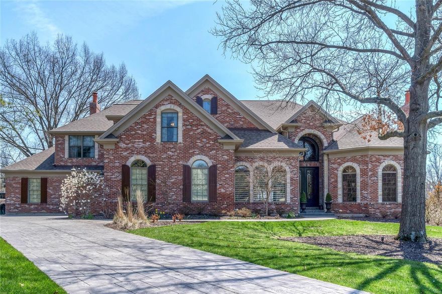 Spectacular 1.5 Sty Estate home with over 9000 sf of living space! Extraordinary 9’ wrought iron double doors lead to 2-sty foyer highlighted by dramatic sweeping staircase, library with built-in bookcases & fireplace, elegant dining room & 2-sty great room with wall of palladian windows, floor-to-ceiling fireplace & wet bar. State-of-the-art kitchen featuring granite countertops, custom cabinetry, professional quality appliances, center island & planning center adjoins light-filled breakfast room, delightful 3-seasons room & hearth room with stone fireplace. Sumptuous master bedroom suite with 2 walk-in closets, marble bath & sitting room with fireplace & access to private deck. 3 additional bedroom suites plus bonus room & loft room complete the living quarters. Walk-out Lower Level with huge recreation room, family room with fireplace, 2nd kitchen, game room, exercise room, bath & 2nd laundry. Parklike 1-ac grounds include 2 decks, patio, pool, hot tub, green house & 4-car garage.