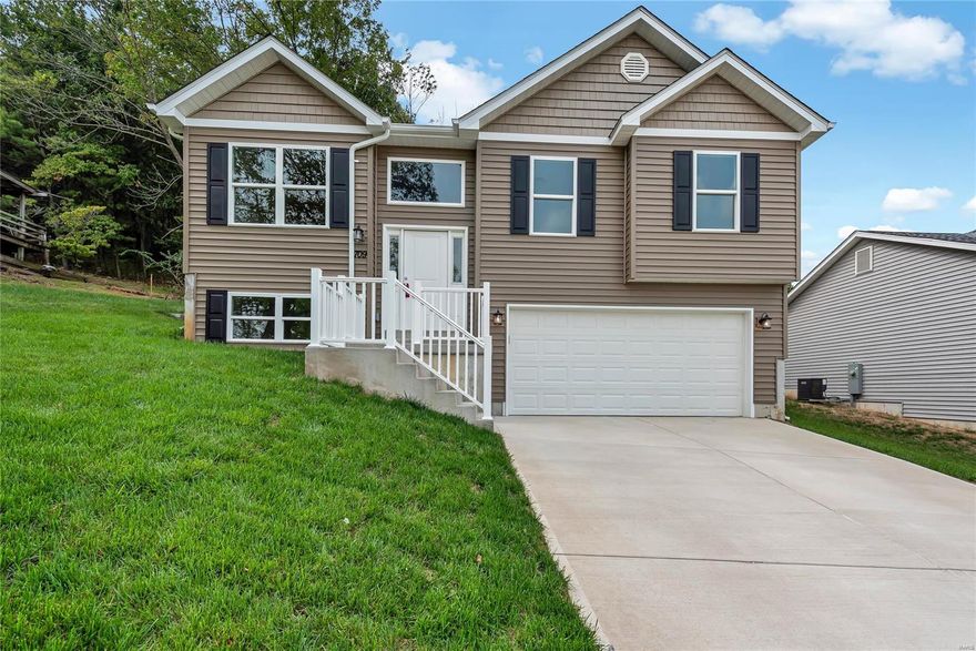 New Construction and USDA eligible 0% down payment! This beautiful split foyer is ready for new owners now! With total living area of over 1600 square feet, 3 bedrooms and 3 full baths, this home gives everyone their own space. The main floor features a kitchen with soft close cabinets and drawers, a spacious island and stainless steel appliances, a large dining room and living room combo with dramatic vaulted ceilings, main floor laundry, an owners suite with a private full bath, 2 additional bedrooms and and another full bath. In the lower level you will find a huge family room with a direct vent gas fireplace and a 3rd full bath. The oversize garage allows for boat/trailer parking or even a workshop in the second bay plus the 6 car driveway! Stepping through the back door to the private patio designed for entertaining with the perfect back drop of trees/woods. All brand new and awaiting new owners!