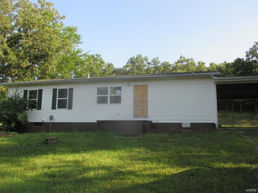 WOW! GREAT PRICE REDUCTION ON THIS GREAT investment opportunity or rehab and make a great home. Large 4 bedroom 2 bath ranch on a large lot with a walk out basement and huge 2 car carport. Split bedroom design with the master bedroom being on one end of the home and the other 3 generous sized bedrooms and a bath on the other end. Nice hearth room right off the kitchen with a wood burning fireplace. Huge walkout basement for plenty of storage or to finish off. SpecialListingConditions: Foreclosure