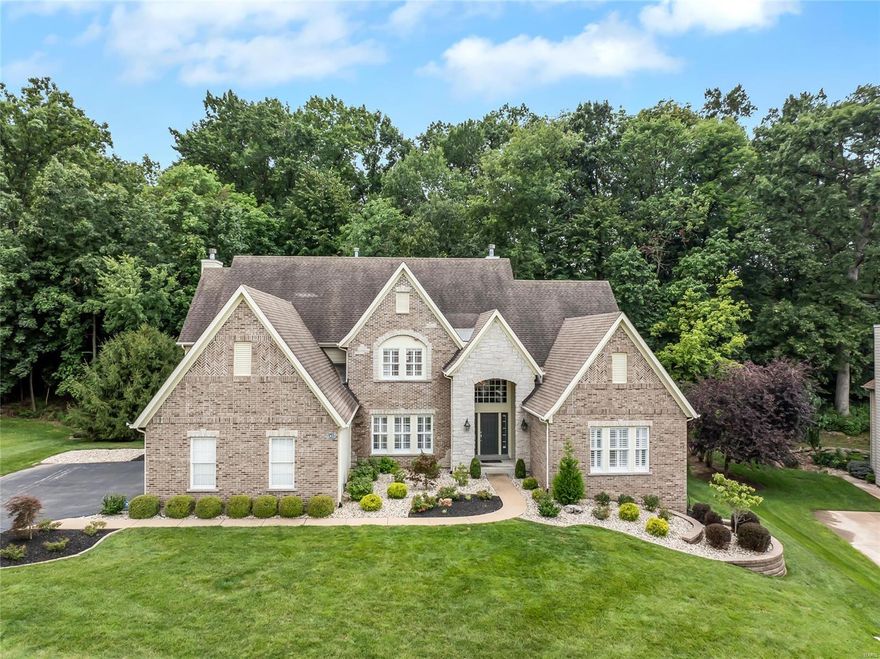 This magnificent 4-bedroom, 3.5-bathroom is sure to impress! The 2-story family room, w/ atrium windows & fireplace surrounded by built-in book cases, invites relaxation. The chef’s kitchen, featuring a huge center island, flows into the hearth room w/ its own fireplace &dining area. The primary bedroom suite features a WIC, coffered ceilings & a spa-like bath w/ dual vanity, jetted tub, & shower. Also on the main level find the dining room, laundry room, half bath & lovely office w/ built-in book cases. Upstairs, find 3 spacious bedrooms & 2 baths. Enjoy outdoor living on the cozy patio. A perfect blend of elegance & comfort! Updates to the home made by the current owner include new flooring, remodeled kitchen & baths, Master bath heated floor & tile, plantation shutters, crown molding & custom wine cabinet. This home offers a tranquil backdrop of mature trees & a lot line that extends significantly beyond the treeline, providing space for outdoor activities or future enhancements.