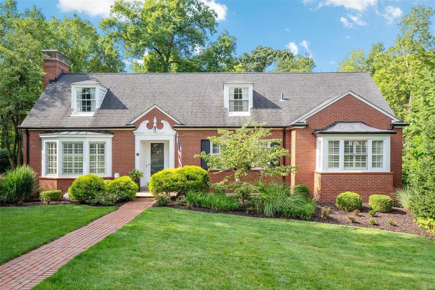 Updated Webster Park Charmer with all the Bells & Whistles! This chic home is the perfect blend of traditional architecture and modern amenities. A gracious living room with bay window, built-ins & gas fireplace sets the tone for casual elegance. The updated kitchen (stainless/custom cabinetry/granite countertops) opens to the dining room & bonus sun room. A main floor primary bedroom suite features a customized walk-in closet and designer bathroom with dual sinks, marble countertops & tile floor. An additional bedroom (or office), full bath & laundry room complete this level. Upstairs find two large bedrooms, full bath, loft area & brand new carpet. The finished walk-out lower level has LVP flooring, gas fireplace, kitchenette, half bath & second laundry room. Outside the double doors you will find a FABULOUS covered patio with bead board ceiling, fans, fireplace, TV & built-in grill. Side entry 2-car garage, professionally landscaped corner lot & coveted location. Welcome home!