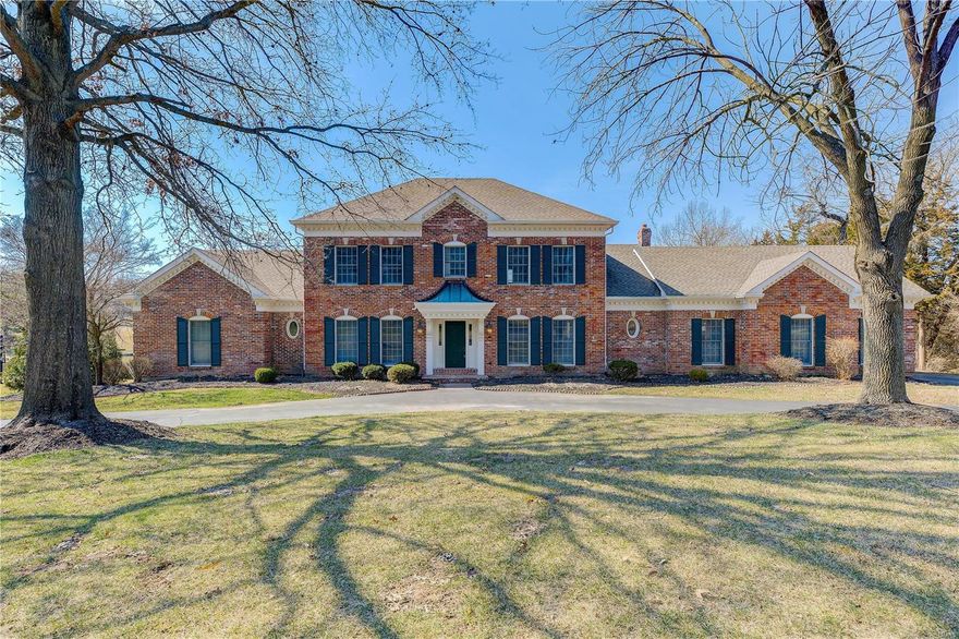 Elegant 1.5 story tucked away on a lake view 1-acre lot in one of Town and Country’s most picturesque
neighborhoods. Wood flooring flows through much of the main level along with lovely molding and
millwork. An elegant foyer leads to a formal living room & dining room and an impressive great room
with floor-to-ceiling brick fireplace flanked by 2-stry windows. A light-filled sunroom with lake views is
located off the great room. An updated kitchen features custom cabinets, granite counters, stainless
appliances & a center island adjoining the breakfast room. The main floor master features a coffered
ceiling and luxury bath. The second floor is served by 3 generous sized bedrooms with a Jack & Jill bath
and a hall bath. Lower-level entertainment space includes a recreation room with fireplace, office, game
room with wet bar, work out room & full bath. Enjoy the outdoors on the deck or patio overlooking the
beautiful backyard.
