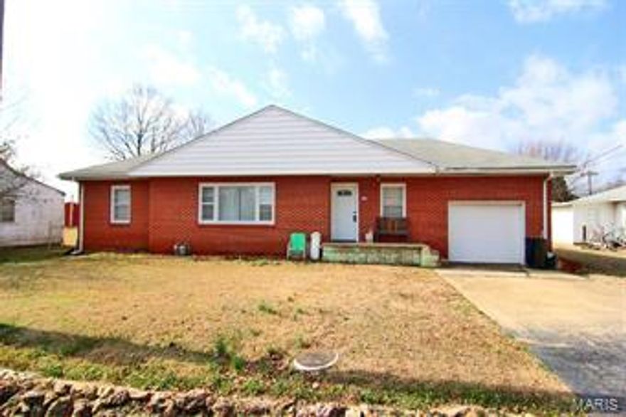 All brick 3 bedroom, 1 bath ranch.  1 car garage, 2 outbuildings, chain link fenced, 10x12 deck.  Hardwood floors in entire home except linoleum in bathroom.  Priced to sell!