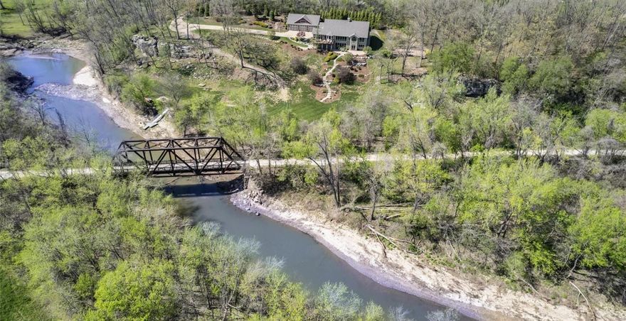 Welcome to your private oasis! This craftsman style design with meticulous attention to detail is nestled on 5+ acres with bluff views. Enjoy unique access to both the Katy Trail & Femme Osage Creek with your own private dock. Paddle board or kayak to the Missouri River. Stunning views & recreational conveniences make this is a one-of-kind-dream come true. 

With 4+ bedrooms, 5 bathrooms, this Smart Home offers added convenience. Gourmet kitchen, great room, dining room and sunroom are all ideally appointed for breathtaking sunsets & nature. Master suite with sitting room offers coffer ceiling, walk-in closet with custom shelving & custom bathroom for spa-like relaxation. 2 additional bedrooms, bathrooms & large laundry room complete this level. The walk-out lower provides a recreation room, custom bar, 4th bedroom, full bath, theatre room & a dedicated home office with gigabit fiber internet. Work from home & stay connected. Live, Play, Explore Defiance. Additional Rooms: Mud Room, Sun Room