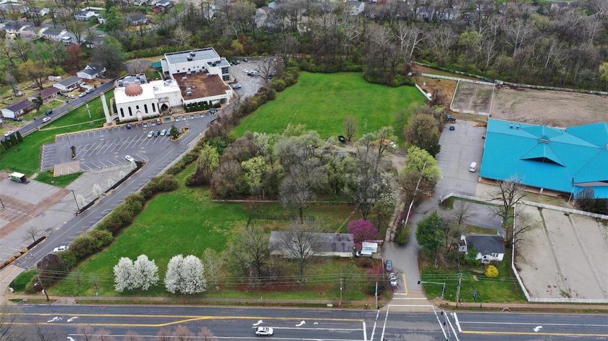 This unique and very rare piece of land has been sought after for many years with many attempts in purchasing. Here is your chance!!
5.2 Acres of Leveled Topography with a 350 ft frontage to Weidman, viewing Queeny Park. Driveway Situated at an existing 4-way stoplight. Zoned R-3, 10,000sq ft min lots. 
Existing home situated on frontage portion of the plat. Greenhouse structure and cinderblock structure sit about 1/2 way back on plat. Deeming home and structures to be a teardown as they are unusable.