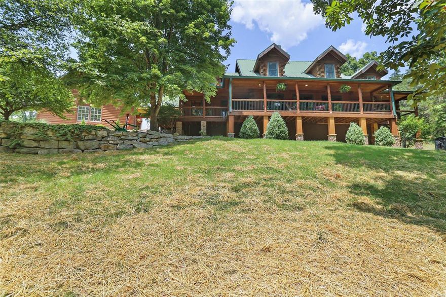 Stunning Log Home on 15+\- Acres! Offering over 4000 sq. ft. of living space as well as outdoor living w/ an extensive wrap around porch, inground pool, hot tub, outside shower, a Stainless Steel bar w/ outdoor oven, Screened in porch, 40x28 3-car garage, 30x40 shop w/ wood stove,  2nd spacious outbuilding w/ elec., outside wood burning stove, pasture w/ fencing. This home has massive wood beams, Australian Cyprus wood floors, a gorgeous WB stone FP that is dbl sided to the Great Rm & Dining area. Gourmet kitchen has SS appls, granite, walk-in pantry, prep sink, wine cooler, built-in oven, custom hickory cabinets, breakfast bar that opens to the dining area & the Great Rm. Master suite offers a jetted shower, walk-in closet, ton of natural light, & access to covered porch.  UL offers 2 bd/1 bath, stackable w/d, & Loft. Walk-out LL has excellent space to entertain w/ 10 foot ceilings, small kitchenet, sleep area/office space, full bath, summer kitchen, rec rm, storage area & more.