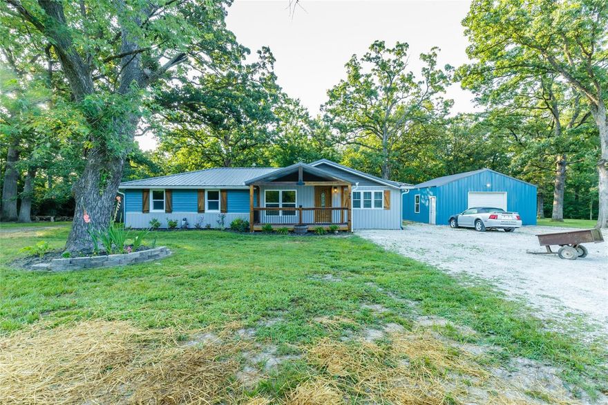 Get your little piece of the country. You will love sitting on the large front porch enjoying a morning or evening.  4 bedroom 2 bath home sitting on just over an acre of ground.  Gorgeous/serene setting surrounded by mature trees.  Master bedroom suite with full bath and large walk in closet (check out the barn doors).  Luxury vinyl plank flooring in living room, kitchen and laundry room. Kitchen has stainless appliances and quartz counter tops. Rustic wood accent wall in living room. Metal roof installed within last 2 years.  24x24 pole barn with 9x24 lean too off the back that has concrete floor and electric. Spectrum internet available. Come on out and take a look.