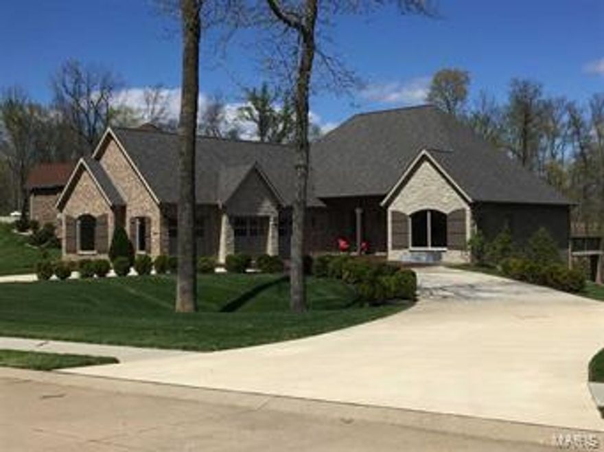 Prestigious, exceptional craftsmanship and commanding views all set the stage as you approach this magnificent brick estate. Upon entrance, you will be amazed by the interior architectural elements: beautiful Italian, marble and hand scraped oak wood flooring, custom cabinetry, quartz countertops, custom lighting, soaring volume ceilings and so much more.  This custom designed home with 5 bedrooms, 4 1/2 baths offers unparalleled quality finishes throughout it’s nearly 4700 sq. ft. finished area.  The excellent utilization of space with multiple gathering and entertaining areas both inside and out, will make you realize your dream of living can easily be attained. There is even an abundance of unfinished area for anything you need to store.   This pristine dwelling located adjacent to the Nicklaus designed golf course of Dalhousie in Cape Girardeau is positioned on a one acre tract in which it offers privacy without sacrificing views for your enjoyment.  The striking and exceptionally