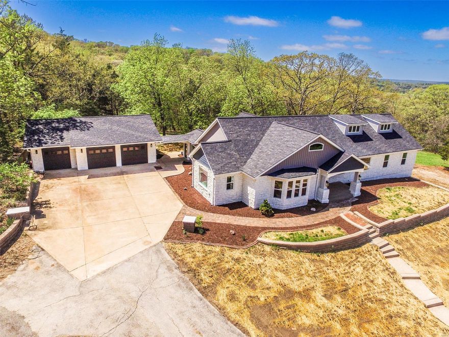 Welcome to your dream home! Stunning ranch-style residence nestled on nearly 5 acres of serene landscape. 
The main level of this beautiful home boasts an expansive layout with 4BR & 3BA, ensuring ample space for family & guests. The highlight, is the great room, showcasing a vaulted ceiling, recessed lighting, & built-in shelving, a perfect spot for entertaining. The spacious kitchen, is functional & stylish, it features an abundance of cabinets, a breakfast bar, Stainless steel appliances & elegant tile flooring.
The primary suite has a coffered ceiling, bay window & luxury bath featuring a soaking tub, walk in shower, his & her sinks, & vanity. The 2nd primary suite would be a great in-law quarters. Formal living & dining rooms offer elegant spaces for entertaining & the sunroom opens to a spacious covered patio, perfect for enjoying the outdoors year-round. The lower level has an additional BR, BA & a huge family room. There is a barn & pasture making it suitable for horses.