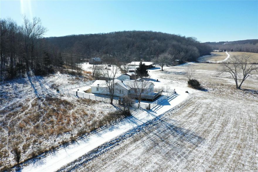 DOWDY CREEK & GREAT HUNTING! Escape to your own private paradise with this stunning 556 acres nestled in a serene valley setting. Abundant wildlife & hunting opportunities as white tail & turkey call this home. This expansive parcel of land is perfect for those seeking a peaceful retreat or an outdoor enthusiast's paradise. Year-round Dowdy Creek offers a great water source plus there is a spring & small wildlife pond. Mostly wooded with some marketable timber & approx. 50 acres open in pasture for your cows & horses! Long private drive leads to the 1940’s home with 3 bedrooms, 2 baths, living room addition with cathedral ceilings, some wood floors, a large remodeled kitchen & a lovely sunroom. Drilled well & new septic system in 2023. 30' x 40' metal garage/outbldg, plus an older barn & equipment bldg. Secluded, 2nd home (not in sight of the main home) has 3 bedrooms, 1 & 1/2 baths, full, walk-out basement & its own drilled well. 1 mile of county road frontage. CALL TODAY!