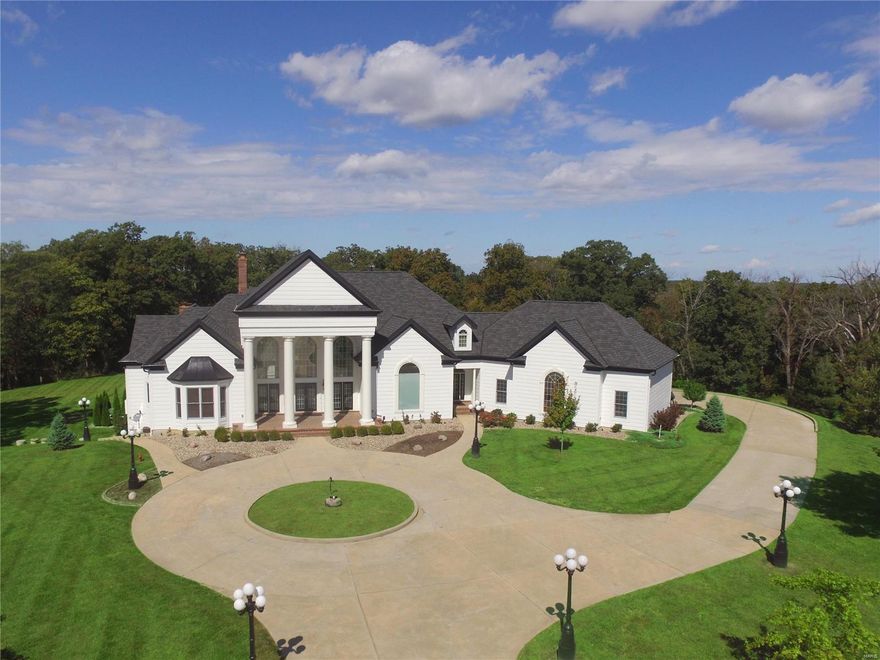 Grand 1.5 story estate on 3 acres in Defiance with 2 pools, 4 car garage, 2 kitchens, 5 bedrooms, 7 bathrooms, 5 fireplaces, 2 decks, and so much more! Soaring ceilings in the two story foyer and living room greet you as you walk in the door. The main floor kitchen is a dream w/ designer appliances, built in coffee machine, large gas cooktop w/ downdraft, and extra large wine column. The master suite (or 'wing') features a sitting room, bedroom, fireplace, walk in closet and large bathroom w/ separate vanities, makeup area and separate tub & walk in shower. The main floor also has a laundry room, 2 half baths, hearth room, breakfast room, formal dining room, and an office. Upstairs are 2 generous sized bedrooms each with their own ensuite bathroom and walk in closet. Downstairs is a large family room, huge rec room, 2 bedrooms, 2 full baths, media room, full kitchen & more. Home has audio throughout, is equipped for a future elevator, and the roof and siding have all been replaced! Some Accessible Features