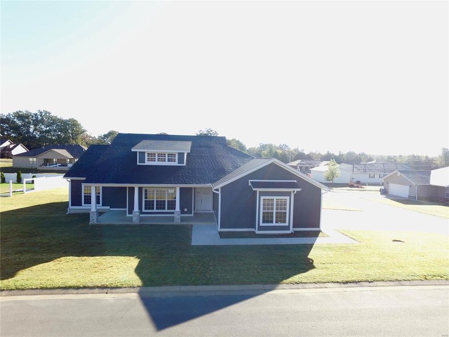 Must see 5 bedroom 2.5 bath, with electric fireplace in living room with rock wall sets it off.  Open floor plan, white kitchen cabinets with 12 ft island bar, 3 car garage, screened in porch and stamped concrete patio, sitting on corner lot.