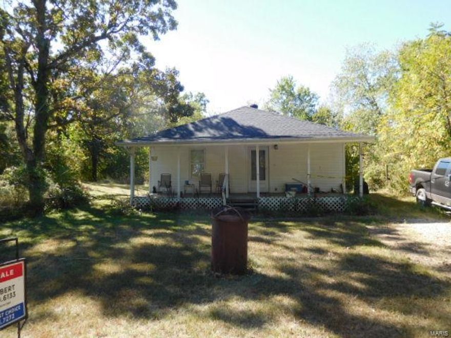 Very nice, secluded 3 bed 2 bath home on an acre of property just outside the city limits of De Soto. Driveway to house is rough, 4WD necessary to traverse. Front porch & Deck needs work, some baseboards and railings. Please use caution on the deck & front covered porch. 
This house is to be sold AS-IS. Seller will do no inspections or repairs. The driveway could be nice with a few loads of gravel & a chain saw to clear some of the foliage back.