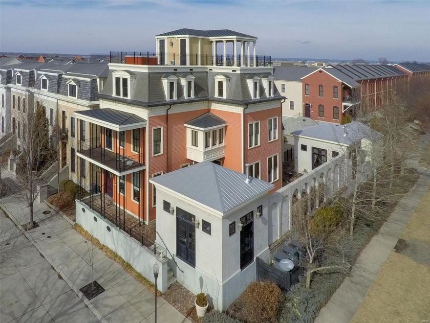 The most highly sought after home in all of New Town awaits! Overlooking the Grand Canal, The Dove House is New Orleans Style Luxury and Modern Elegance combined in this one of a kind 5000+ sq ft Town Home. Boasts 5 bedrooms and 7 baths in main house w/additional bed and full bath in guest house! Features a large cooks kitchen w/ Aga range imported from England, Monogram Luxury SS appliances w/ granite counter tops, opens to light filled hearth room and 12 seating dining area. Designer finishes such as: TexSton Venetian Plaster on most walls and Cork flooring throughout. Walls of shelving surround in library, Temp controlled floor to ceiling wine room, State of the art speaker system inside and out. Elevator serving all 5 levels including basement. Balcony overlooks plunge pool on private patio nestled between detached guest house and extra living retreat. Fabulous Rooftop with Catalina Spa has 360 degree views. Offers 4 Car garage, garden shed and so much more! Click above for video! Additional Rooms: Mud Room