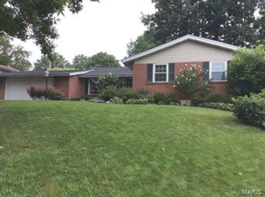 This home has everything you have been searching for! Great curb appeal, open floor plan, rich hardwood floors, fireplace, combination living room & dining room, elaborate crown moldings; large eat-in kitchen, main floor family room, Master bedroom with adjoining full bathroom plus 3 more bedrooms and hallway full bathroom on the main floor. The lower level consists of a gigantic recreation room, possible 5th and 6th bedroom, utility and laundry area. The grounds are fabulous with an attached over-sized 2-car garage, oversized deck and extensive landscaping. This home has been tastefully updated and decorated. All this home needs is YOU!