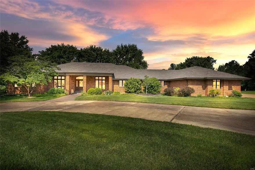 Luxury Sunset Hills estate offers excellent curb appeal as you enter the 3.985 acres of beautifully landscaped, level property. This home boasts over 5,000 sq ft of living space with outstanding build quality throughout. As you step inside, the spacious great room showcases a vaulted ceiling, fireplace & gorgeous European French Oak flooring! The formal dining room & living room provide plenty of space to entertain. The split bedroom floor plan provides privacy! The primary suite features an adjoining luxury bath featuring large walk in closet, double sink, jetted soaking tub & separate shower! The kitchen presents plenty of custom cabinetry with crown molding, high end appliances, large center island & an adjoining breakfast room with bay window. Additional living space is found in the lower level complete w/ 9' pour, family room offering a 2nd fireplace, half bath, laundry room & tons of storage. Plantation shutters, 3 car garage & neutral décor are just a few of the many features!