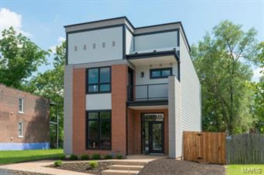 Gorgeous!  Luxury home designed for today’s lifestyle while thinking about the future.  Main floor highlights include open floor plan of living room, dining room and kitchen with large windows and tall ceilings that are typical in the neighborhood, using today’s materials that include hardwood floors, granite counter tops, stainless appliances, canned lights, and wood stairs with wrought iron accents.  Upstairs is found a large master suite with balcony, walk in closets, dual vanities, and walk in shower.  Two additional bedrooms with shared bathroom and laundry room complete the floor.  Designed to be highly energy efficient and allow graceful, comfortable living for today.  Plan for tomorrow with wide hallways, no entry steps accessible sinks and pre-planned elevator shaft.  Located in The Grove neighborhood, just blocks from Cortex and Washington University Medical Center.  Close to highways, and soon to Metrolink!  Two car garport coming soon! Some Accessible Features