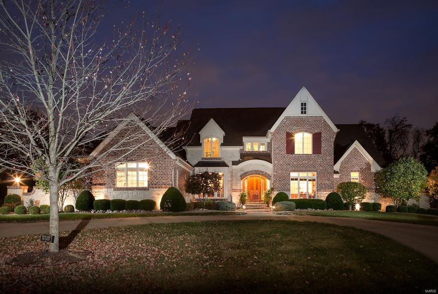 Upon entering you’ll be taken with the gracious entry’s arched openings to the library w/custom woodwork and formal dining room w/trey ceiling. Then you’ll move to the great room, a wonderful space for formal entertaining with a wall of windows and stunning fireplace. The main floor master suite offers custom bath, his and her closets and French doors to a deck. The heart of the home, the kitchen boasts custom cabinetry, top of the line appliances and center island opening to the breakfast room and hearth room with floor to ceiling stone fireplace. The 2nd floor offers  built-in bookcases with a bonus room and 3 bedrooms and 2 baths.  The LL is a home of it’s own complete with fitness room, wine storage, billiard room, family room and 2nd kitchen/ bar space overlooking the pool and outdoor living space your own private oasis! House has a 45,000 kilowatt natural gas
generator Additional Rooms: Mud Room