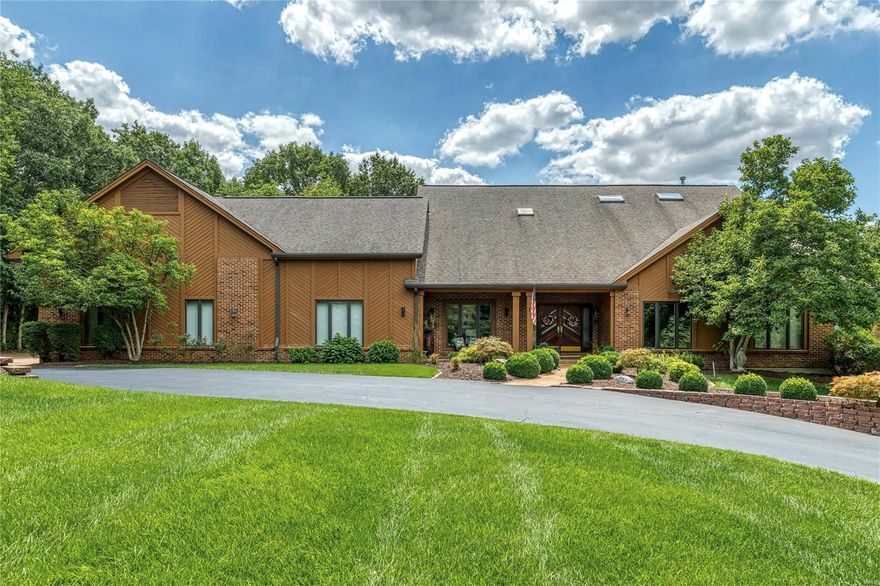 Spectacular brick & cedar Contemporary in premier Town & Country location!  This Kerr-designed ranch home features an open floor plan with vaulted ceilings, skylights & custom built-ins. Wide covered porch entrance leads to impressive foyer, formal dining room with lighted display case, step-down living room and stunning family room with pine-lined cathedral ceiling, floor-to-ceiling brick fireplace, built-in bookcase, wet bar & 2 sets of sliding glass doors that open to patio. Designer kitchen with 42” cherry cabinetry, granite countertops, premium stainless steel appliances & double islands adjoins breakfast room with box window & light-filled sunroom. Vaulted master bedroom suite offers an appealing retreat with customized walk -in closet, lavish bath with jetted tub & access to patio. 3 Additional bedrooms & hall full bath complete the main floor living quarters. Situated on a 1.5-acre set-back lot with 3 patios, pool, circular drive & oversized 6-car garage with 14’ overhead door. Additional Rooms: Sun Room