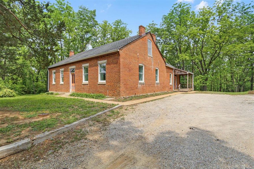 POSSIBLE COMMERCIAL OPPORTUNITY! PRIME LOCATION! DON'T MISS OUT, HOME & 35+/- ACRES SOME AC IN THE CITY LIMITS, SOME UNINCORPORTATED! This 1.5 story home is all brick home built in 1900, a very unique home located on 35+/- Acres. The foyer entry leads to an open stairway to the upper level to find you 2 bedrooms w/hardwood floors & full bath. The main level features some 4 panel solid wood doors & trim, a massive living/dining combo w/hardwood floors, wood stove & 10' ceiling. Nice kitchen w/42' maple cabinets, 11' ceiling, breakfast bar & breakfast area. Master bedroom suite w/hardwood floors & full bath. Additional bedroom & laundry room. There is a partial cellar-type basement unfinished & AN ASTONISHING WINE CELLAR BASEMENT WITH 2 ROOMS & STONE WALLS, 1 ROOM HAS 29 X 18 BRICK BARREL CEILING. 2 car detached garage. SERENE & BEAUTIFUL! Property is being sold in current condition, "Sold As IS' seller to do NO repairs. POTENTIAL FOR POSSIBLE FUTURE COMMERCIAL OR SMALL WINERY! Additional Rooms: Wine Cellar