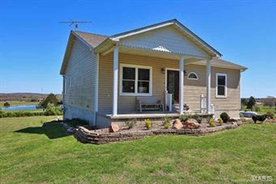 Fantastic 4 year old home on over 5 acres.  This home has incredible finishes.  3 bedrooms, 2.5 baths, over sized 1 1 car attached garages with workshop.  Beautiful 18 x 10 sun room + 18 x 12 deck with gorgeous views.  30 x 40 outbuilding with electric & 2 over sized doors.  Separate 16 x 80 slab with hookups & septic. Additional Rooms: Sun Room
