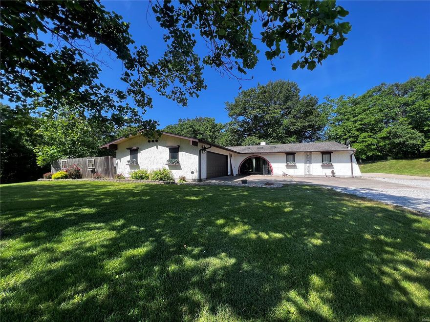 The joys of entertaining…belong to you in this 3 bedroom, 2.5 baths, Stucco-finished, ranch home that has been updated. Enjoy gourmet cooking in its elegant, sun-filled kitchen, with two dining areas for a large crowd or small gathering. After dinner, relax by the fireplace in your living room or walk out to the private patio area. You can be the ultimate host in the 20’x40’ finished, detached shop with its very own ½ bath with large covered patio area for all your enjoyment. The home also offers a 2-car, attached garage along with a small shed. All this sitting on 1.88 ac. +/-.