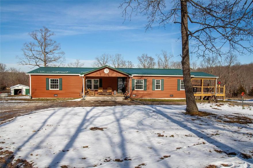 Secluded 3 bed, 2 bath home with multiple outbuildings situated on nearly 29 acres! This home offers an adorable covered front porch, incredible HUGE covered deck including a ceiling fan, PLUS an awesome sunroom! Walking into the home, you'll notice a cute entryway leading into either the spacious living room or the formal dining room. The gorgeous kitchen provides a breakfast bar, center island, stainless appliances, pantry, pretty backsplash, & plenty of cabinet/counter space. Off the kitchen is an additional dining area that adjoins to the living room & also provides access to the sunroom! The spacious master offers a walk-in closet & its own private bath! Additionally, there are 2 nicely sized guest bedrooms, a full guest bathroom, as well as the laundry/mudroom that leads out to the deck. Outside the home, there are multiple outbuildings for storage, hobbies, & vehicle/UTV parking. The land is perfect for ALL of your outdoor/recreational needs or desires! Schedule your showing!