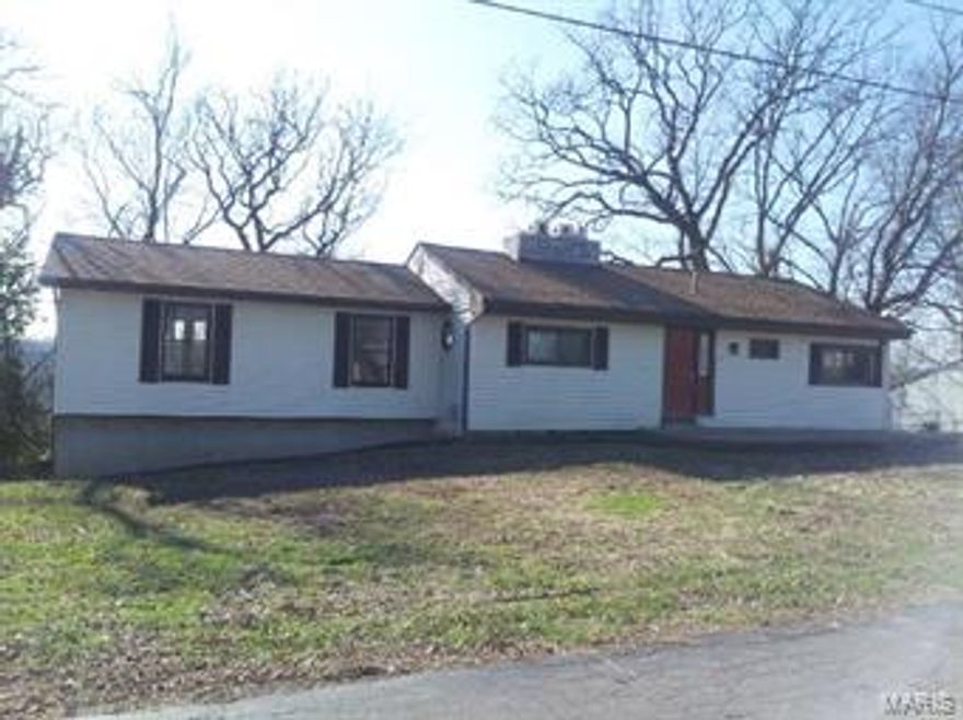 Check out this fantastic view! You can see for miles, will feel secluded - very little traffic on this street - but centrally located. Hang out in the family room/living room this winter in front of the fireplace with snow covered trees surrounding you, and then in the summer you will feel as if you are in the middle of a park when you open up the backyard and add walking trails. Many updates include: beautiful new flooring; newer custom kitchen cabinets with crown molding and appliances; new light fixtures; new front door with side light, and interior six-panel doors; freshly painted throughout. Walk out basement with new exterior door and windows, sump pump, and a second fireplace - finish this area out for a cozy den. Extra basement area under the huge Master Bedroom. Fully tiled full bath with jetted tub. Great location!
