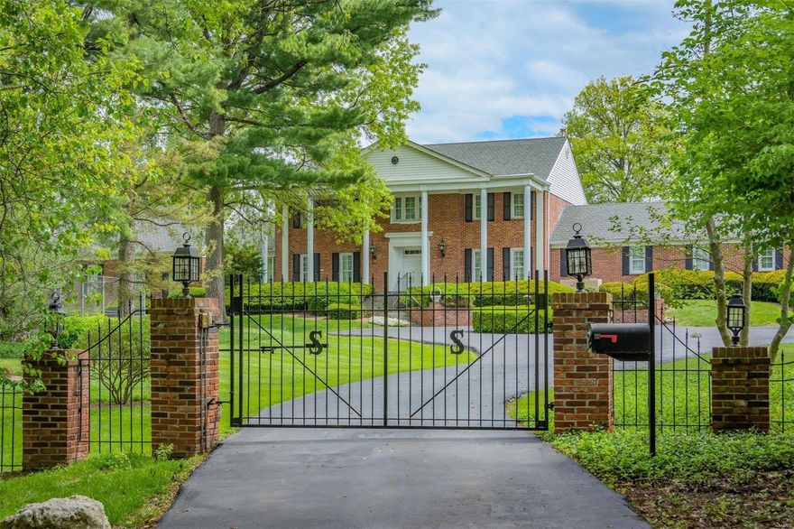 Tucked away at the end of this quiet Ladue lane, you will find a private, gated, 2 acre estate featuring a pool and tennis court.  This stately 2-story home offers over 6,000 square feet of total living space, in addition to a pool house complete with kitchen, rec area and full bath.  This center hall Colonial provides a large first floor master suite with his and her baths and walk-in closets, plus an adjoining den with wet bar.  A second master suite and 3 additional bedrooms and 2 full baths complete the upper floor. Beautiful mill work and moldings adorn the formal dining and living rooms.  A family room with stone fireplace opens out to a patio overlooking the lovely backyard and in-ground pool. The entire grounds are completely fenced. A spacious rec room features a large wet bar and fireplace that highlights the lower level.  For the car enthusiast, there is a 6 car garage.  This is truly a wonderful opportunity to add your personal touches to this outstanding property.